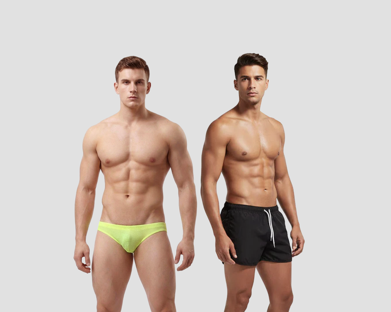Two men wearing swimwear on a plain background