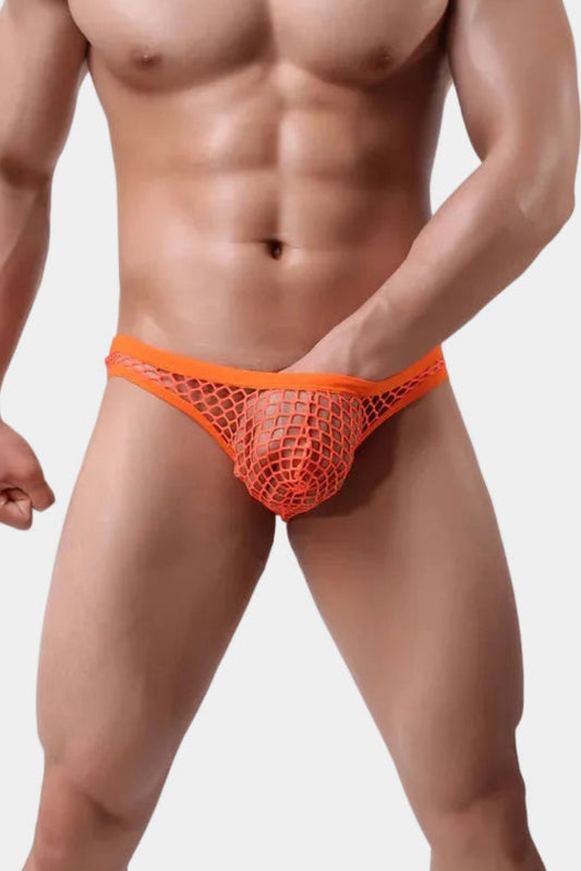 Man wearing an orange mesh underwear on a white background