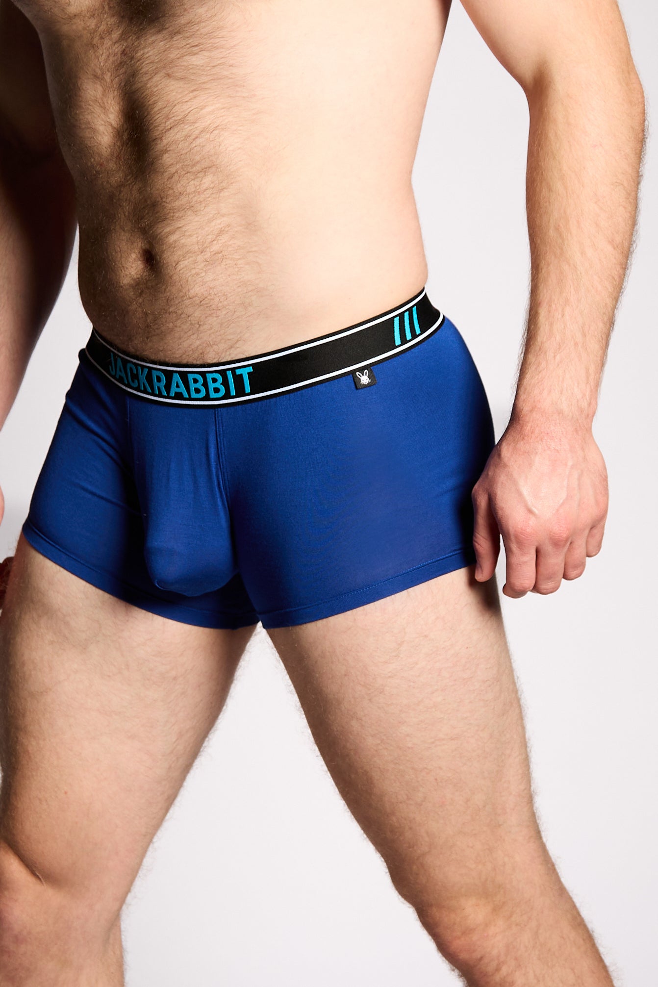 Blue boxer briefs with a brand logo on a plain background