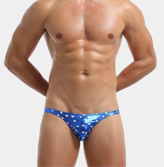 Man wearing a blue stars and stripes swimsuit on a white background