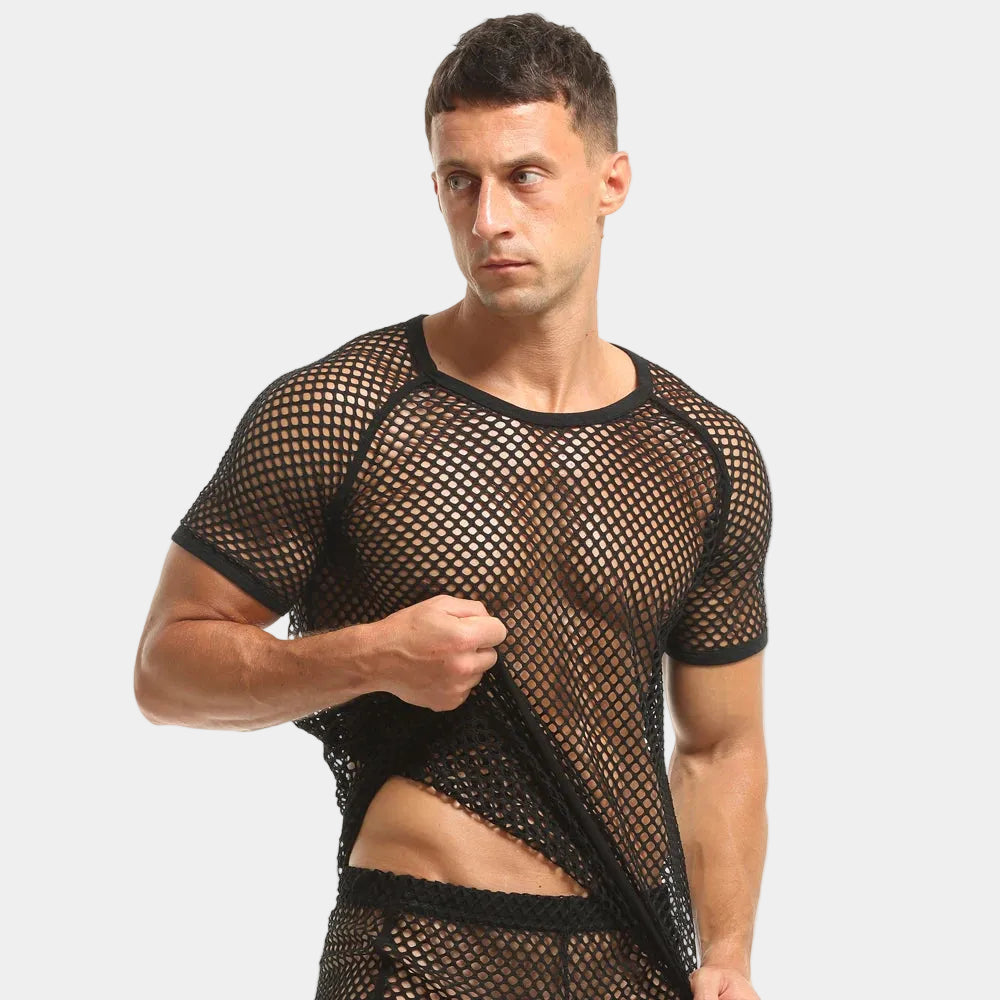 Man wearing a black fishnet shirt on a white background