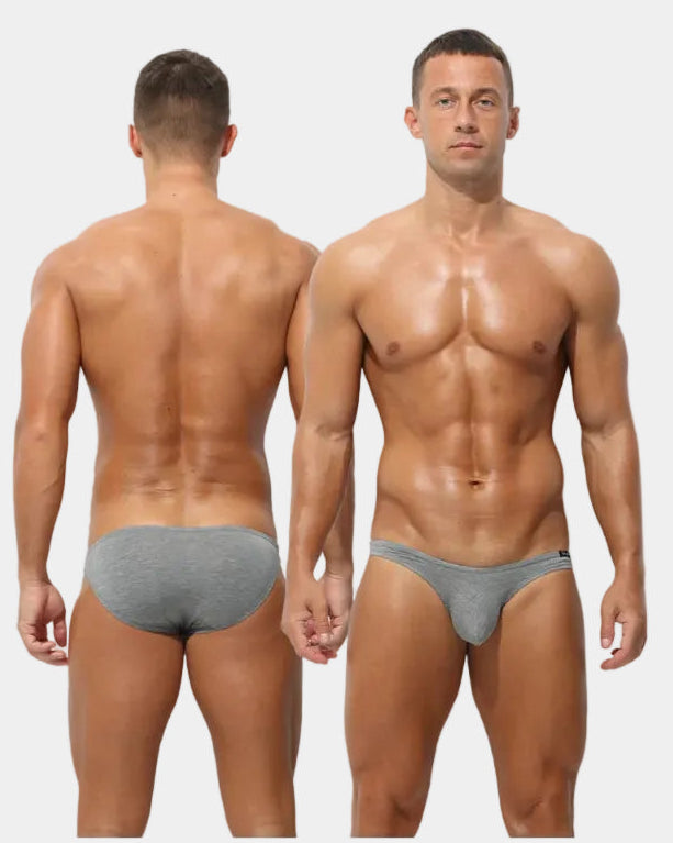 Man wearing gray underwear from front and back views with text 'ATTENTIVE' on a gray background.