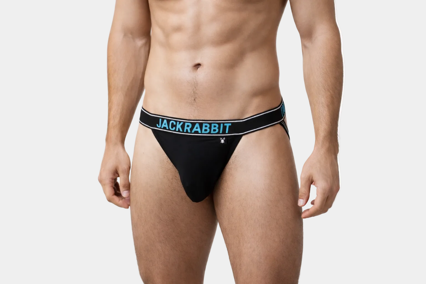 Man wearing black men's underwear with 'Jackrabbit' branding on a white background